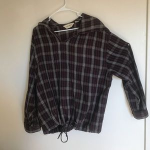 Plaid hooded Eddie Bauer woman’s flannel shirt.